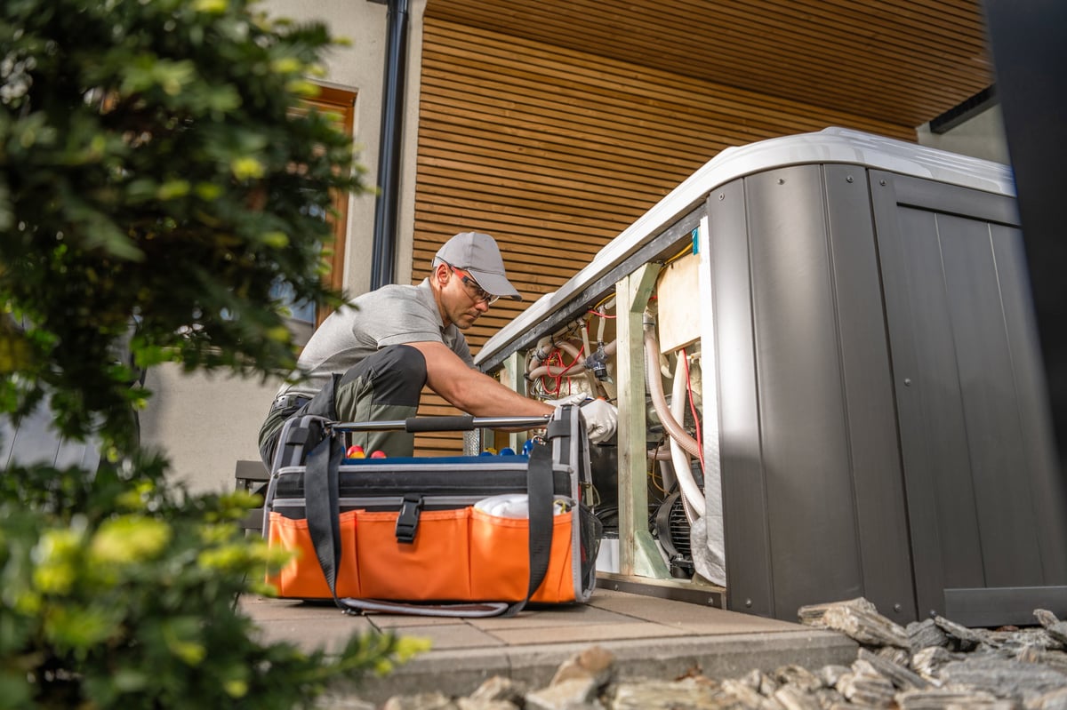 Garden spa technician performing modern hot tub maintenance in a backyard garden
